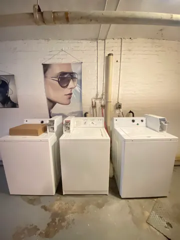 a white house sitting next to a white sink