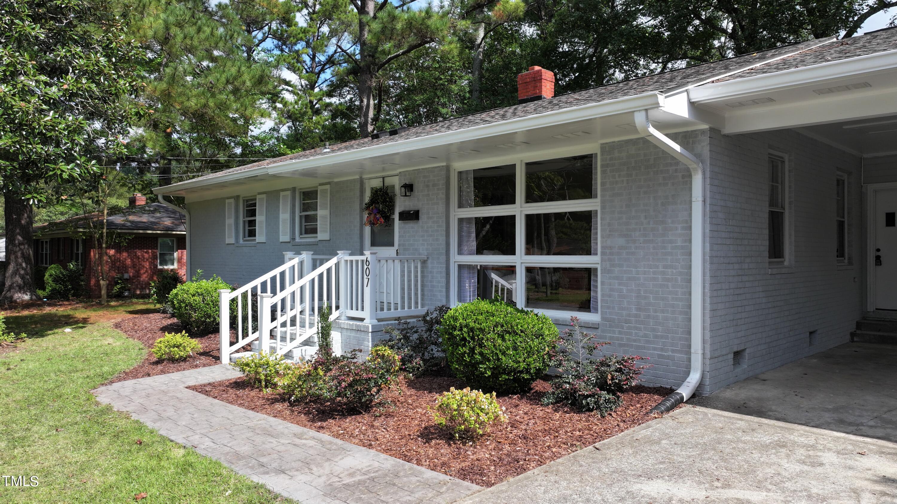 607 Nellane Drive Garner, NC 27529 - Photo 1 of 35 a front view of a house with a yard