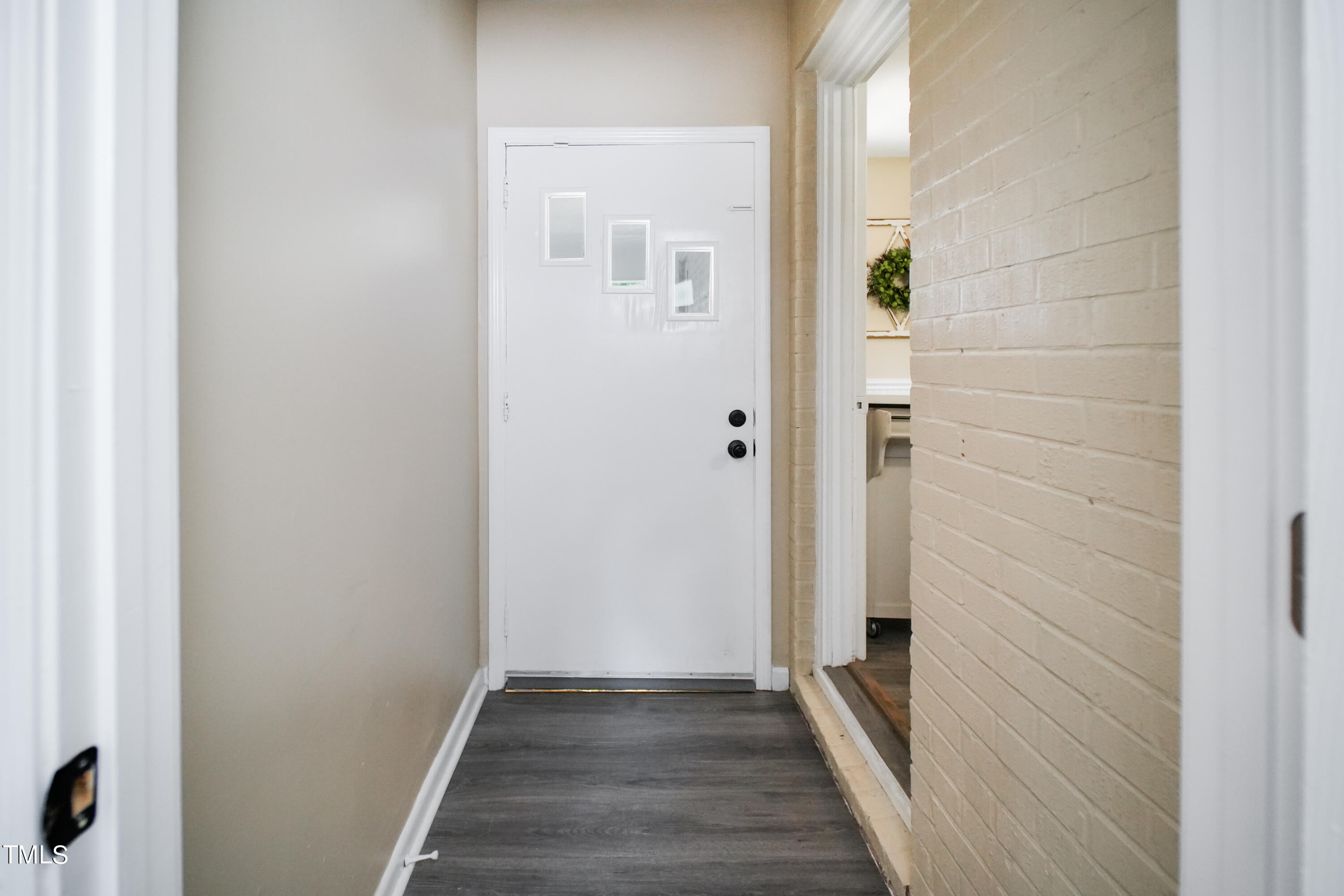 607 Nellane Drive Garner, NC 27529 - Photo 20 of 35 a view of a hallway with wooden floor