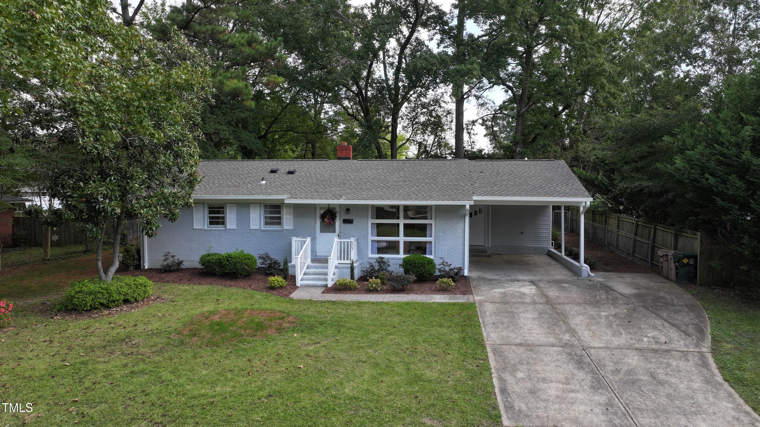 607 Nellane Drive Garner, NC 27529 - Photo 2 of 35 a front view of a house with garden