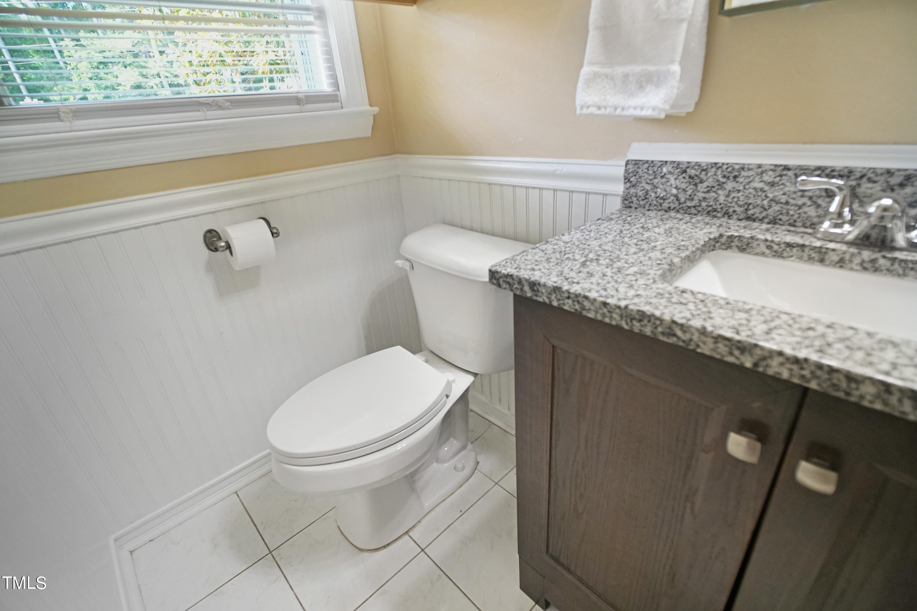607 Nellane Drive Garner, NC 27529 - Photo 22 of 35 a bathroom with a granite countertop toilet and a sink