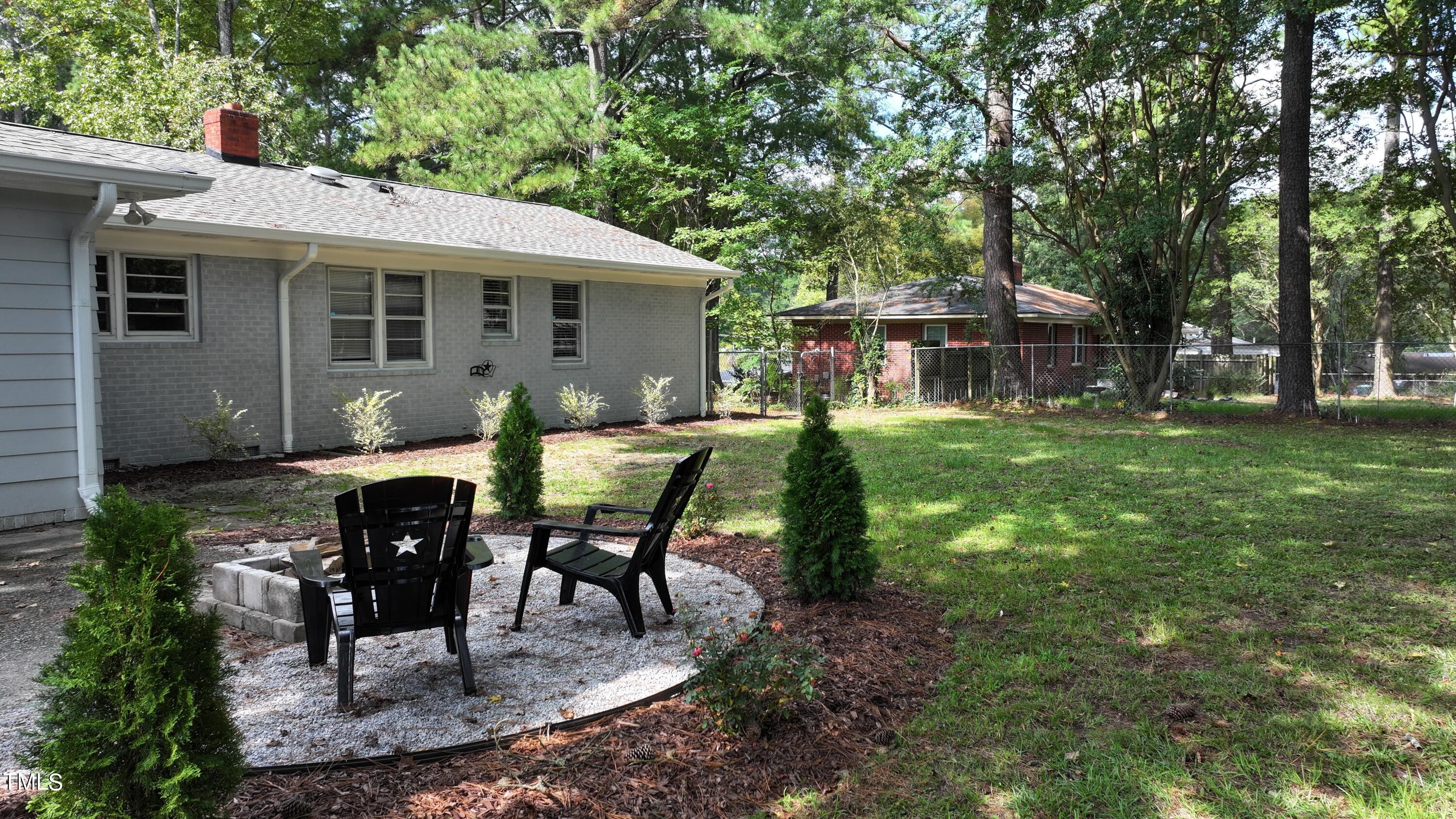 607 Nellane Drive Garner, NC 27529 - Photo 24 of 35 a view of a house with backyard sitting area and garden