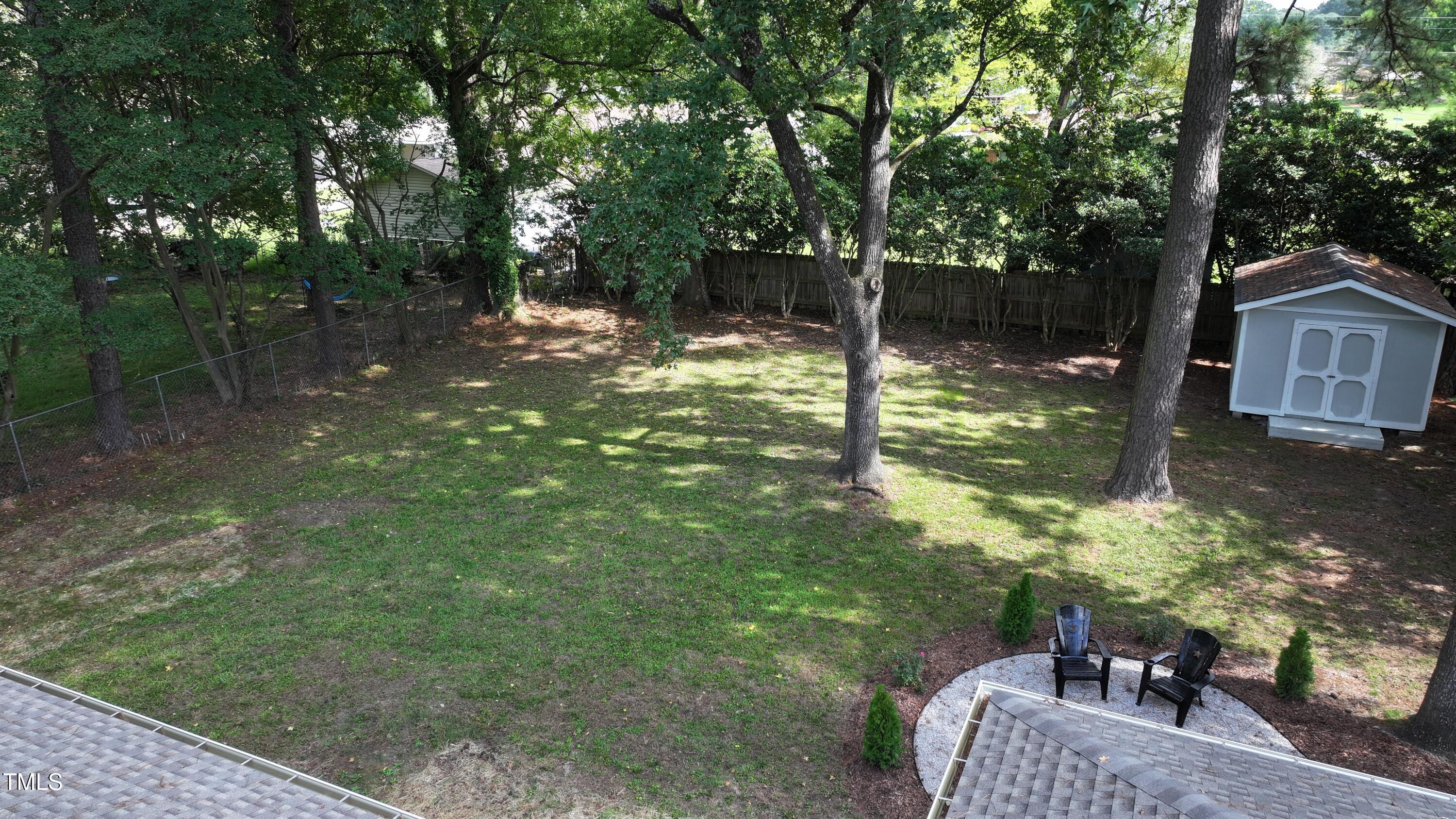 607 Nellane Drive Garner, NC 27529 - Photo 26 of 35 a view of a garden from a patio