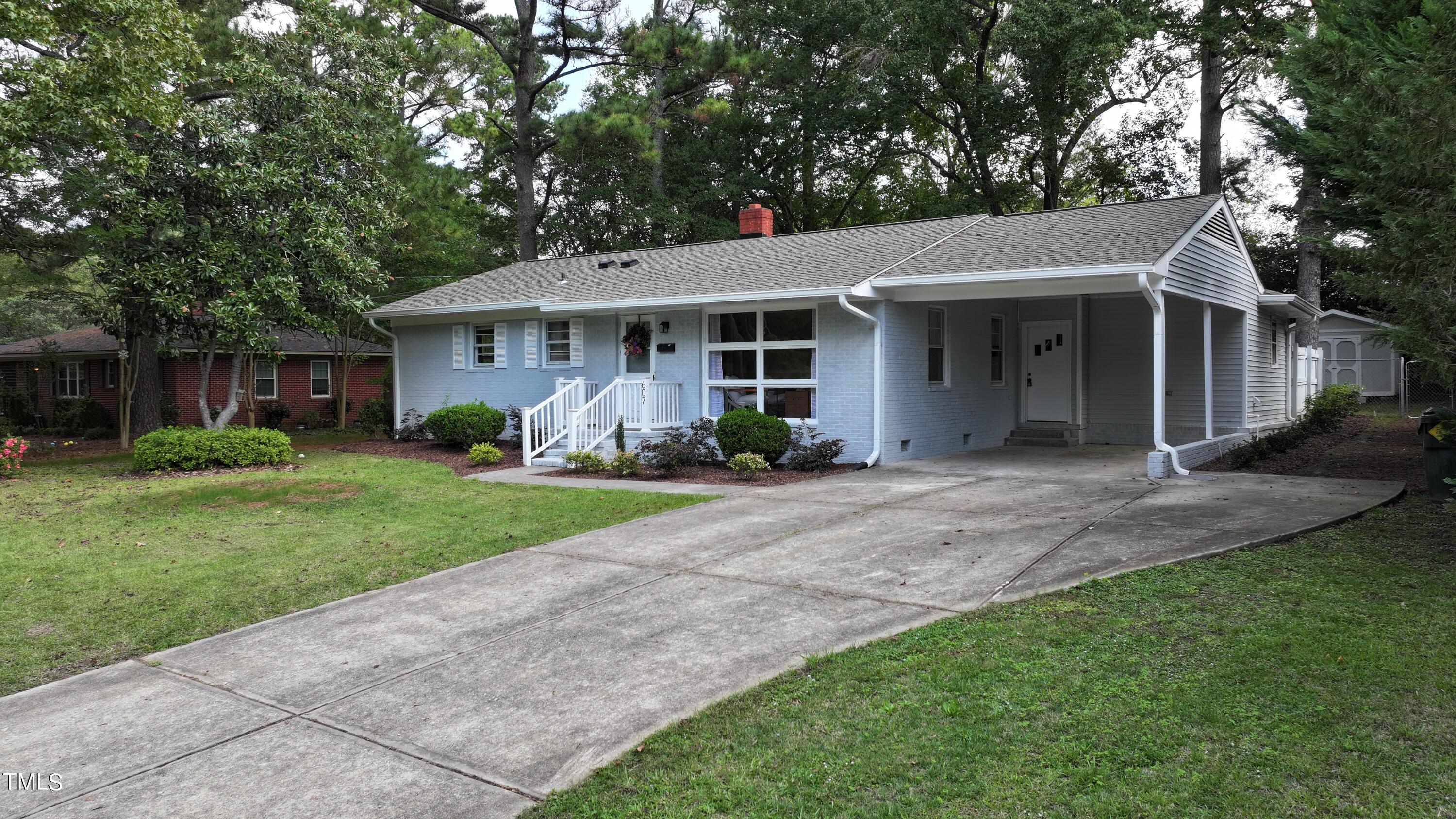 607 Nellane Drive Garner, NC 27529 - Photo 3 of 35 a view of a yard in front of house