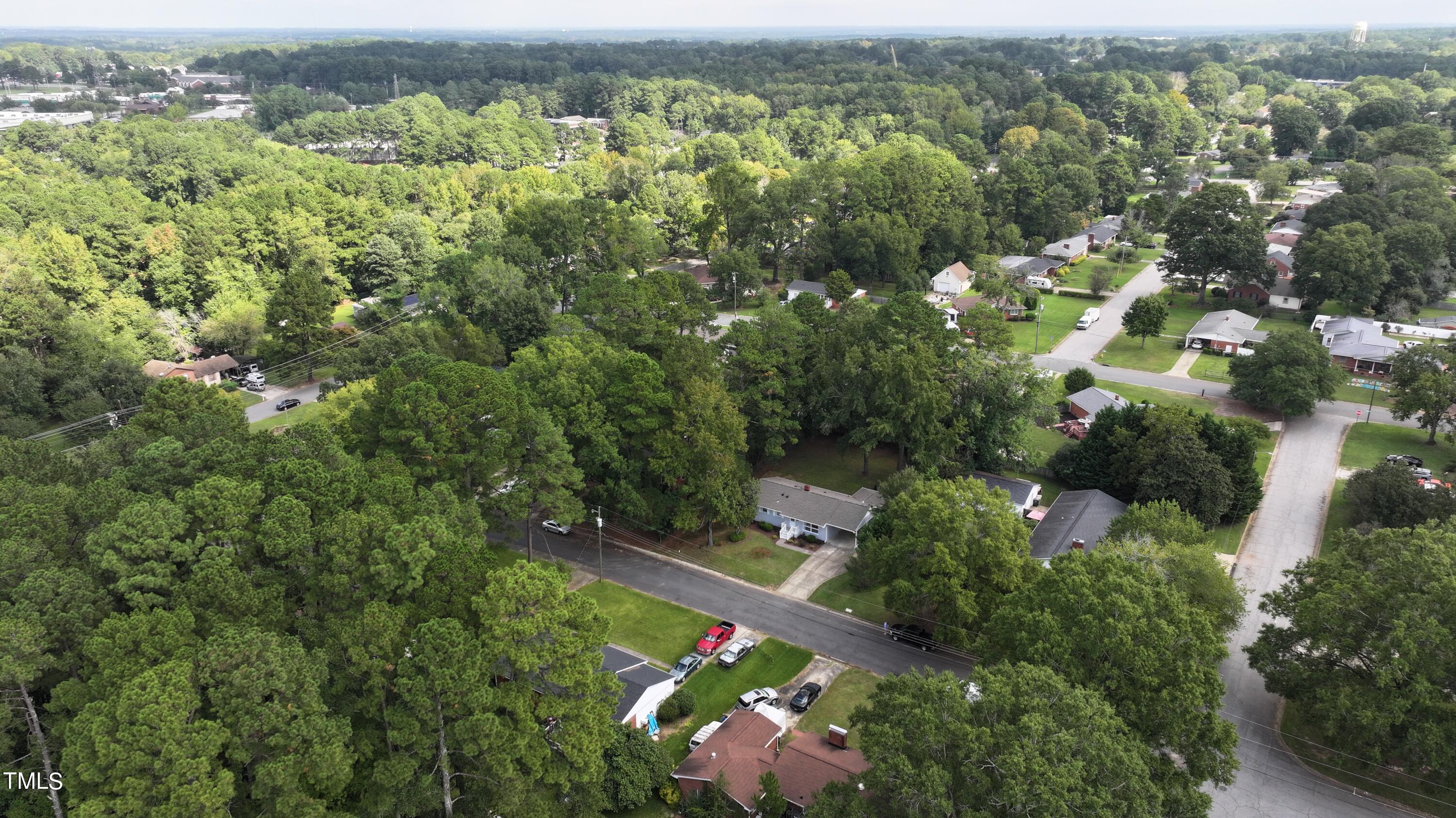 607 Nellane Drive Garner, NC 27529 - Photo 34 of 35 an aerial view of residential houses with outdoor space and trees