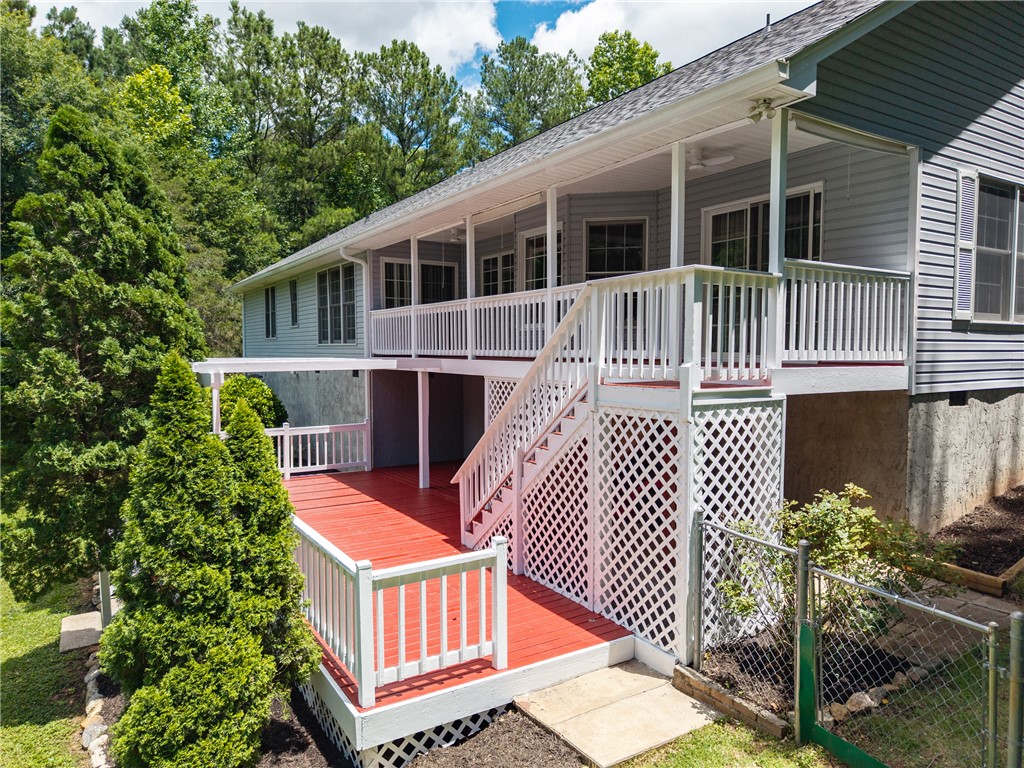 429 Burns Mill Road West Union, SC 29696 - Photo 28 of 49 A spacious outdoor deck with red-painted planks offers verdant views and ample entertaining space.
