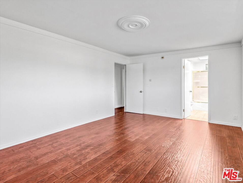12479 Walsh Avenue Los Angeles, CA 90066 - Photo 11 of 21 a view of empty room with wooden floor and fan