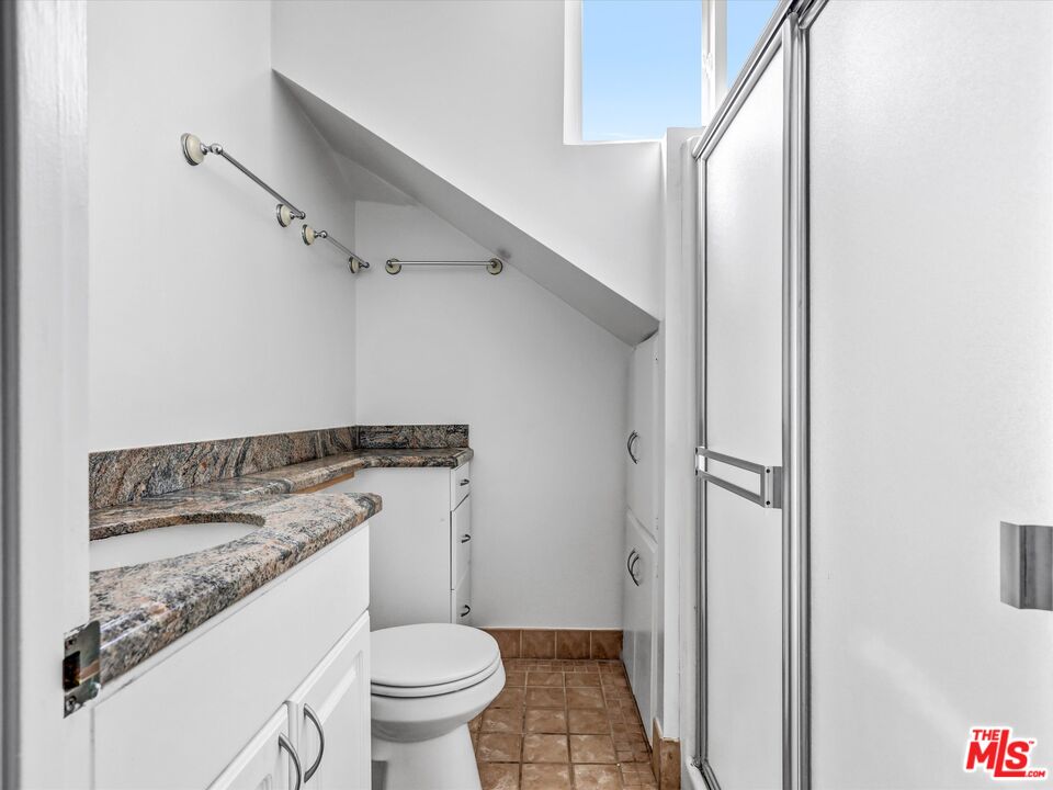 12479 Walsh Avenue Los Angeles, CA 90066 - Photo 15 of 21 a bathroom with a granite countertop toilet and a sink
