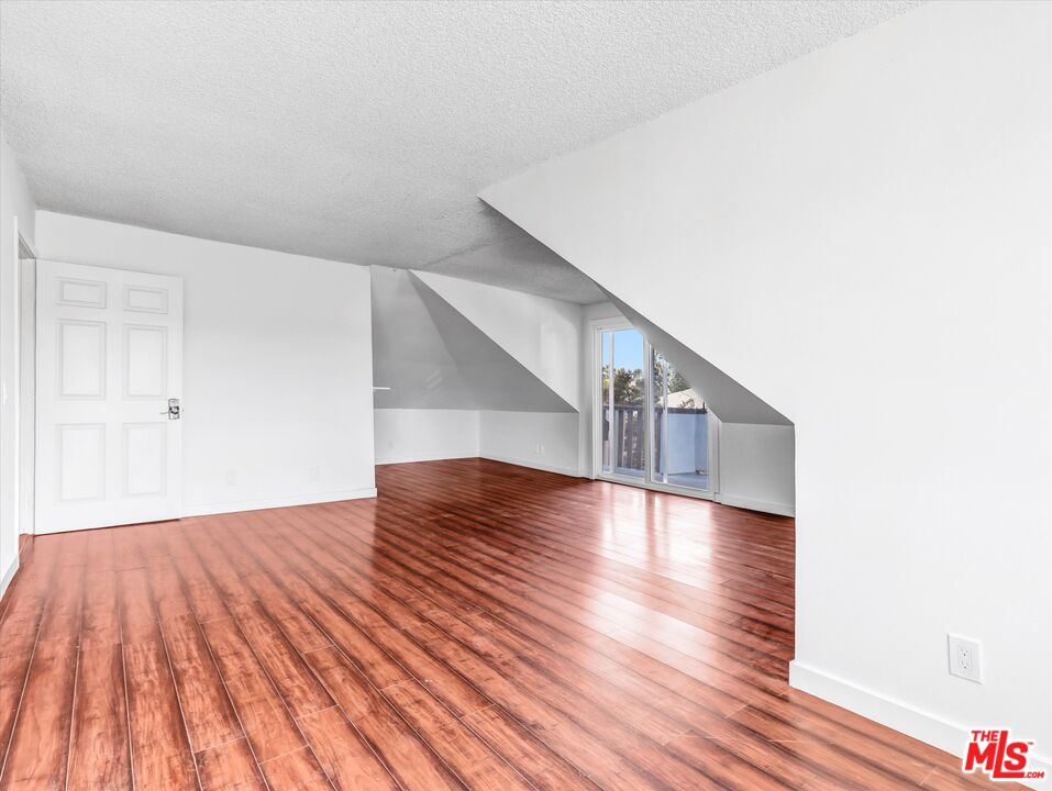 12479 Walsh Avenue Los Angeles, CA 90066 - Photo 17 of 21 a view of empty room with wooden floor