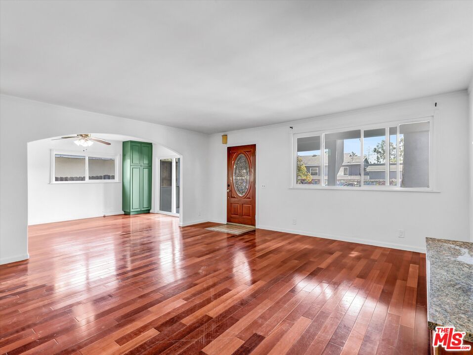 12479 Walsh Avenue Los Angeles, CA 90066 - Photo 2 of 21 a view of empty room with wooden floor and fan