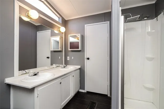 a bathroom with a sink and mirror