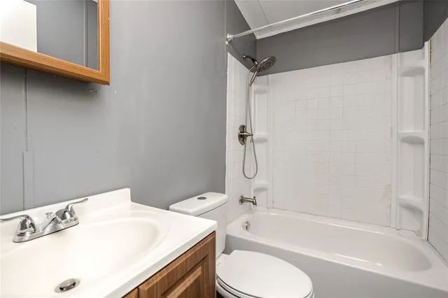 a bathroom with a sink a toilet and a bathtub