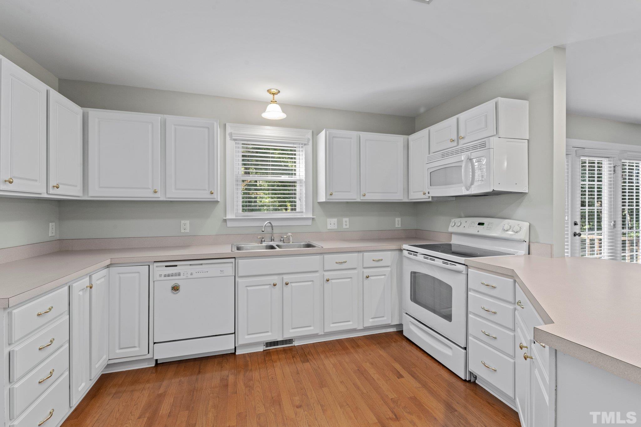 8025 Lockleair Road Zebulon, NC 27597 - Photo 18 of 30 Kitchen features tons of storage and counter space. Freshly painted walls and cabinets. This kitchen sparkles!!!