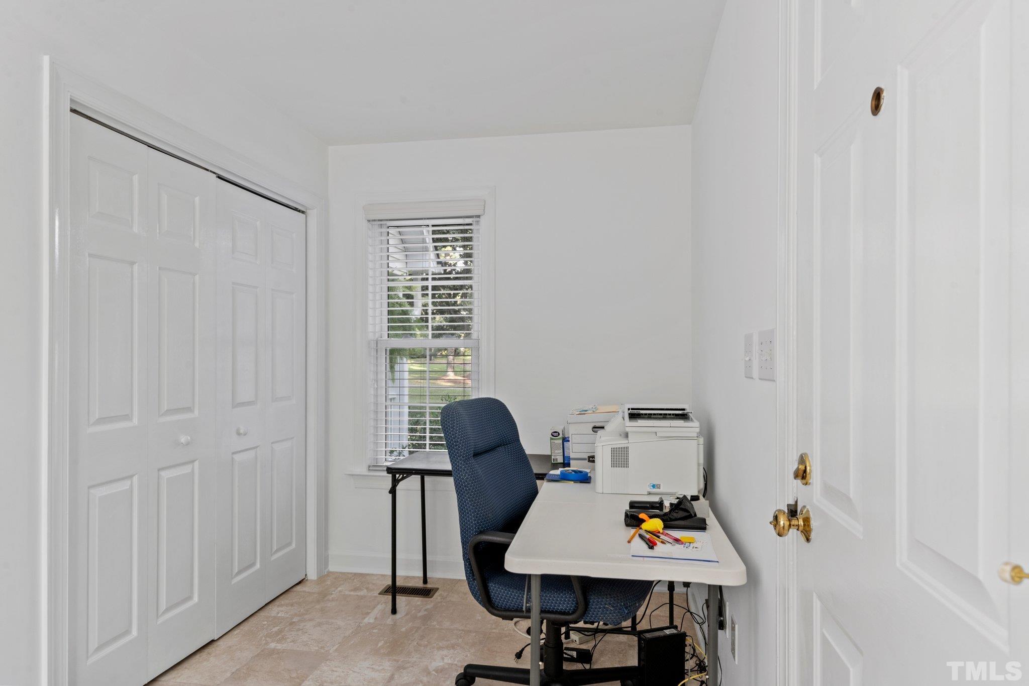 8025 Lockleair Road Zebulon, NC 27597 - Photo 19 of 30 This flex room houses laundry behind folding doors, pantry and office nook. Or can be used as mudroom by installing drop station in place of desk for coats, bookbags, shoes, etc. Door to garage from this room
