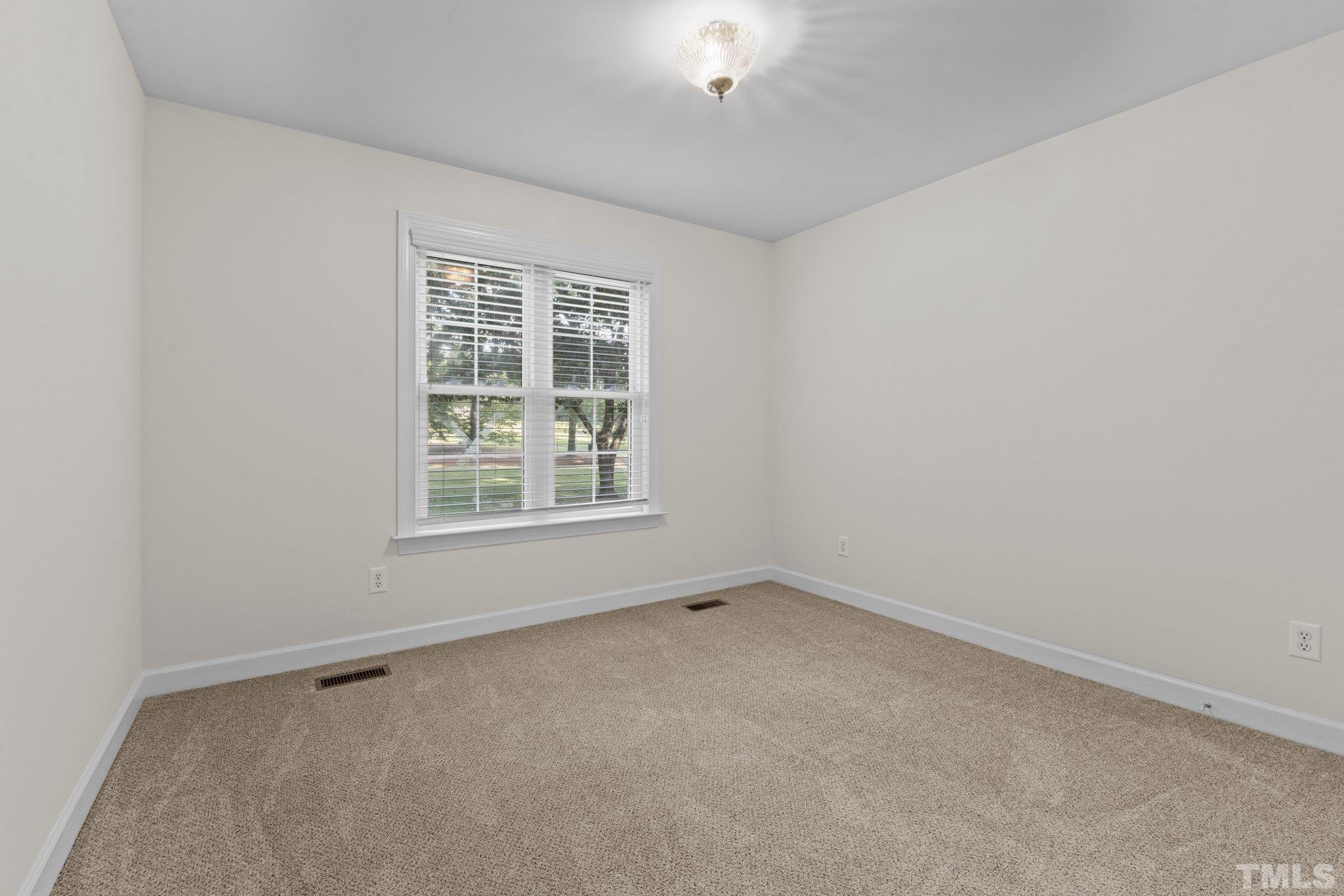 8025 Lockleair Road Zebulon, NC 27597 - Photo 21 of 30 bedroom features fresh paint and spacious closet