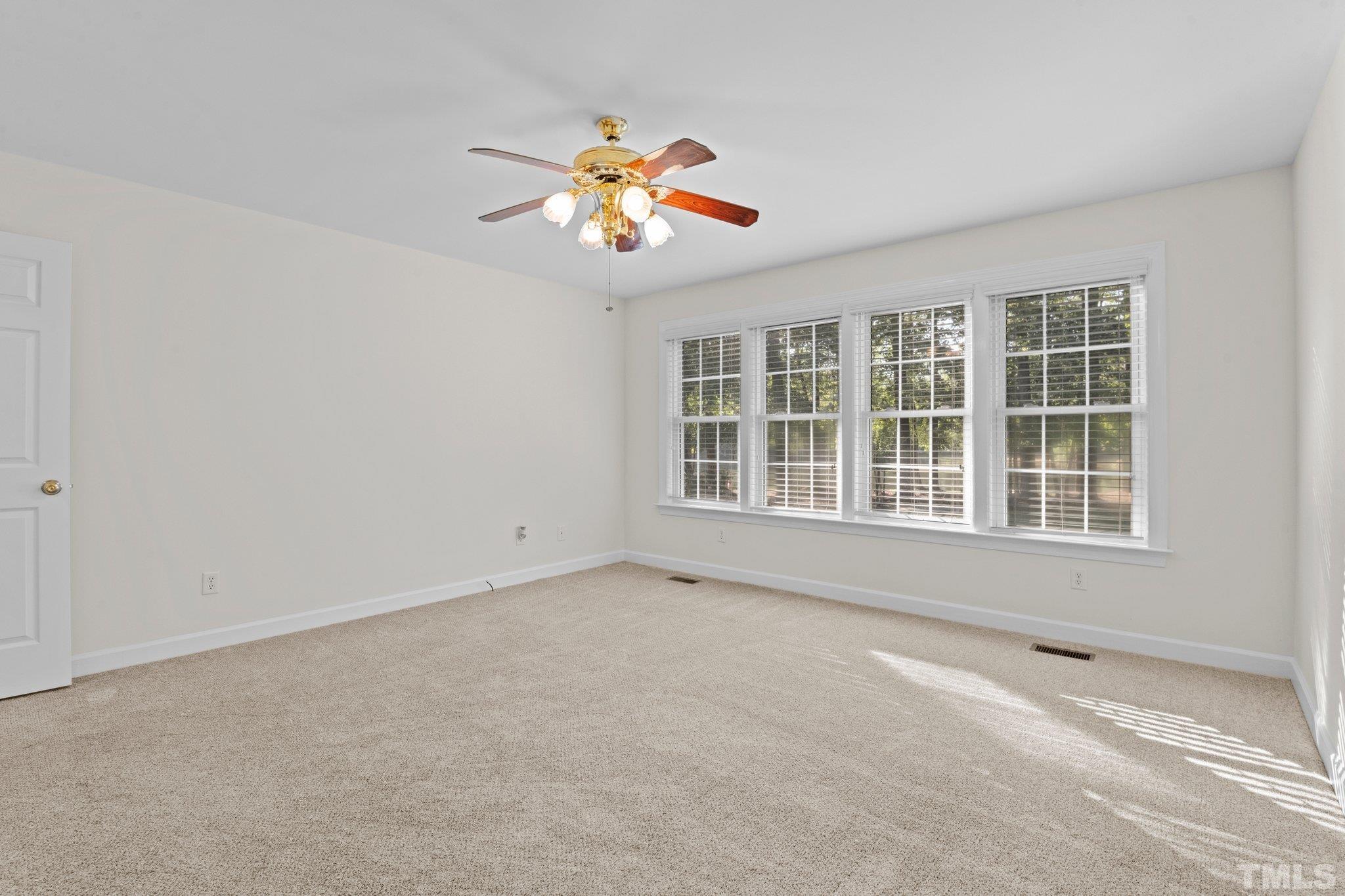 8025 Lockleair Road Zebulon, NC 27597 - Photo 25 of 30 View of master bedroom from dressing area.