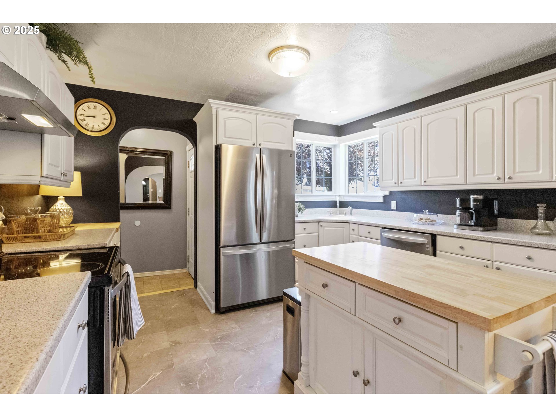 567 20th Avenue Longview, WA 98632 - Photo 12 of 41 a kitchen with a refrigerator sink and cabinets