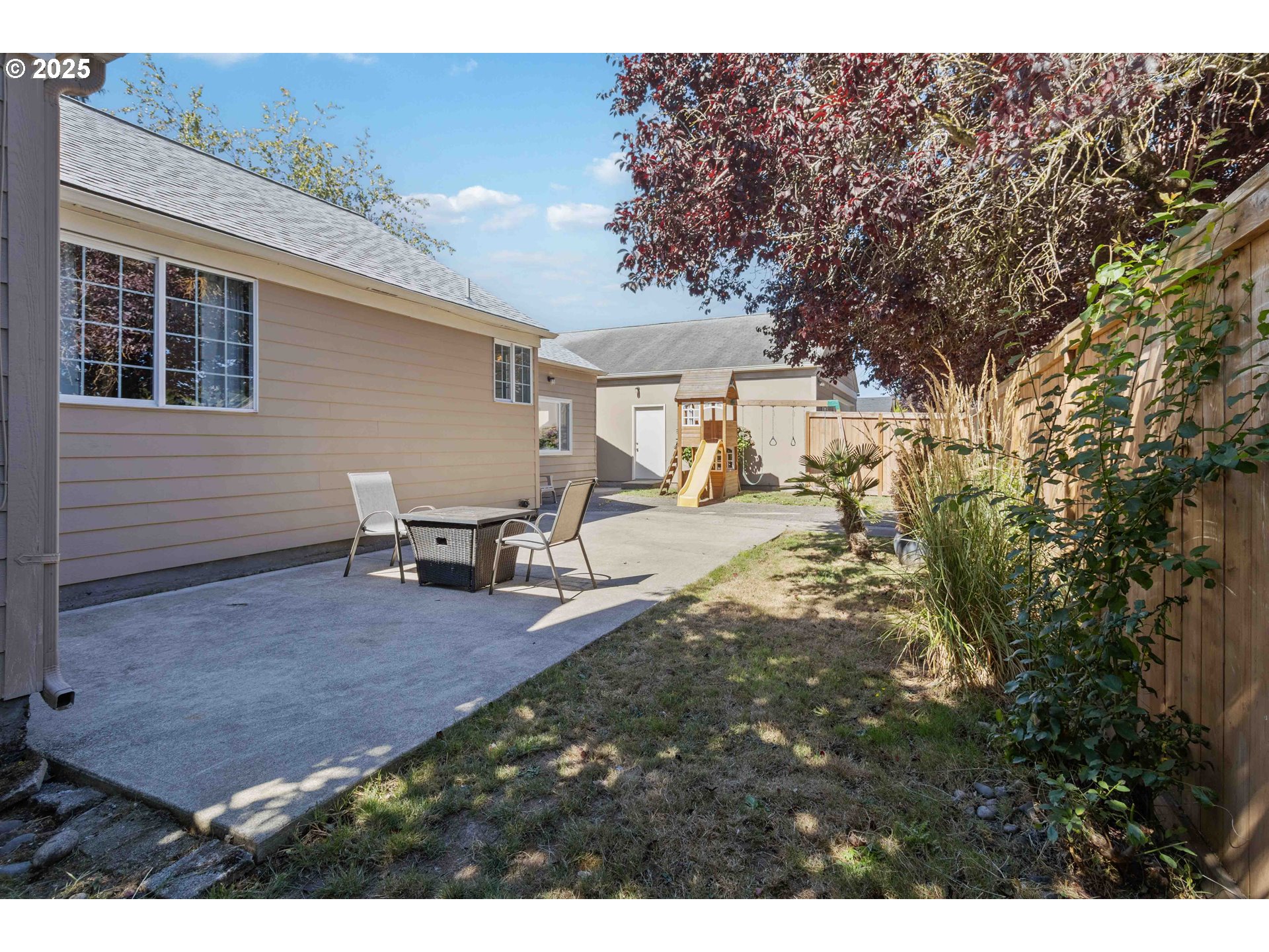 567 20th Avenue Longview, WA 98632 - Photo 29 of 41 a view of a backyard with table and chairs