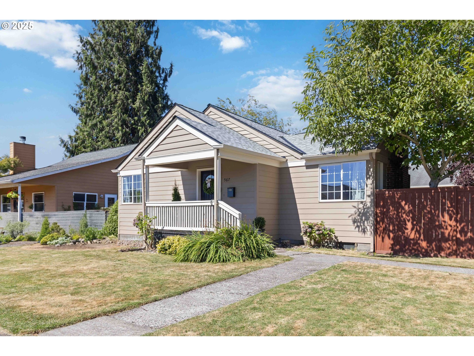 567 20th Avenue Longview, WA 98632 - Photo 41 of 41 a front view of a house with a yard and potted plants