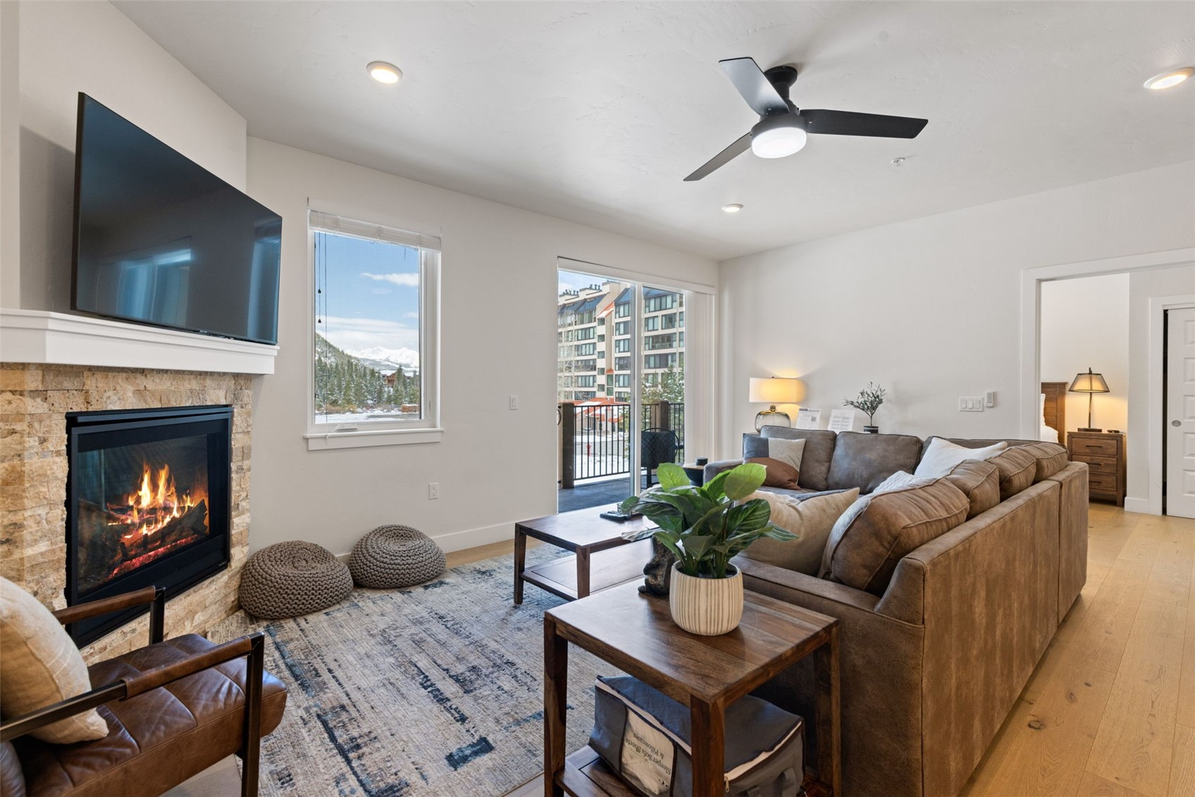 23 Clearwater Way, Unit 106 Keystone, CO 80435 - Photo 2 of 21 a living room with furniture and a fireplace