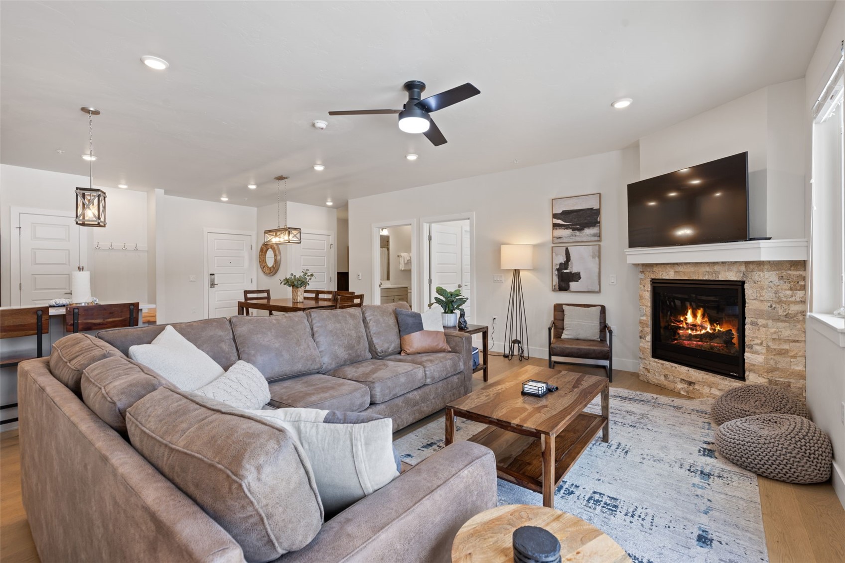 23 Clearwater Way, Unit 106 Keystone, CO 80435 - Photo 4 of 21 a living room with furniture and a fireplace
