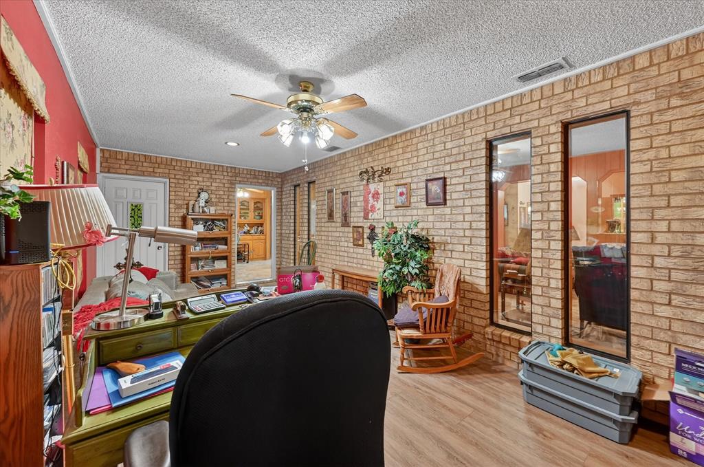 1605 Heather Court Cleburne, TX 76033 - Photo 22 of 33 a room with furniture and a flat screen tv