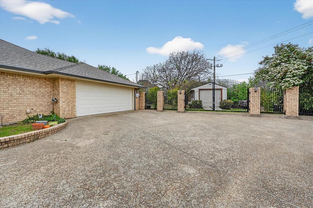 1605 Heather Court Cleburne, TX 76033 - Photo 26 of 33 a front view of a house with a yard and garage