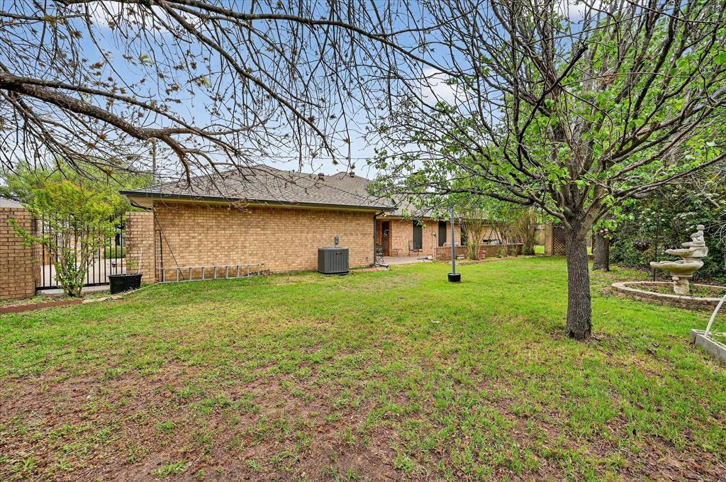 1605 Heather Court Cleburne, TX 76033 - Photo 29 of 33 a view of a house with a yard