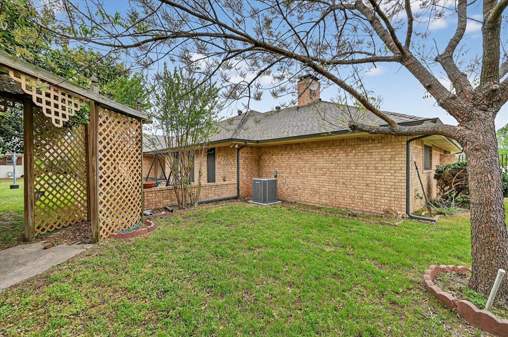 1605 Heather Court Cleburne, TX 76033 - Photo 30 of 33 a view of a house with a yard