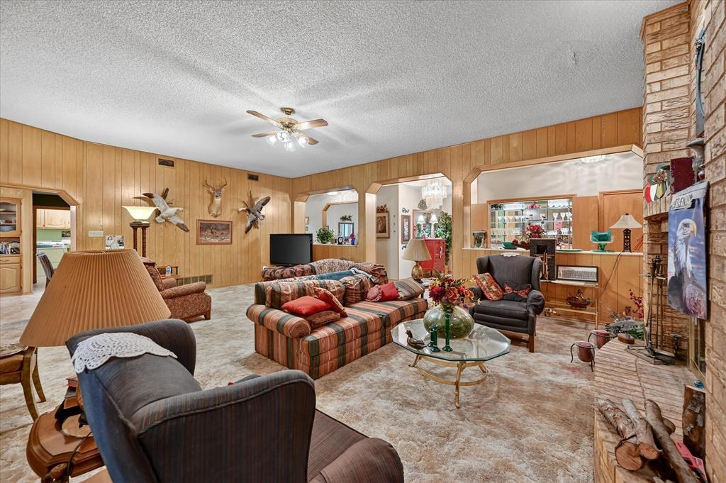 1605 Heather Court Cleburne, TX 76033 - Photo 5 of 33 a living room with furniture ceiling fan and a window