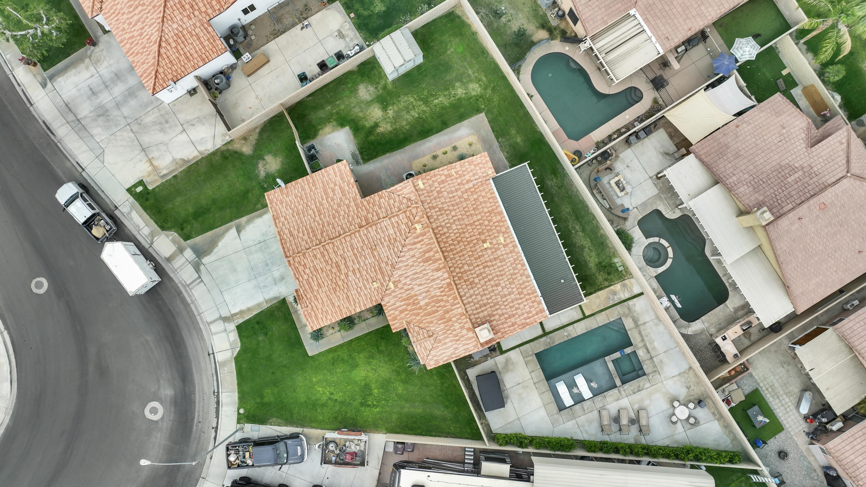 80490 Paseo Tesoro Indio, CA 92201 - Photo 1 of 28 an aerial view of a house with a garden and trees