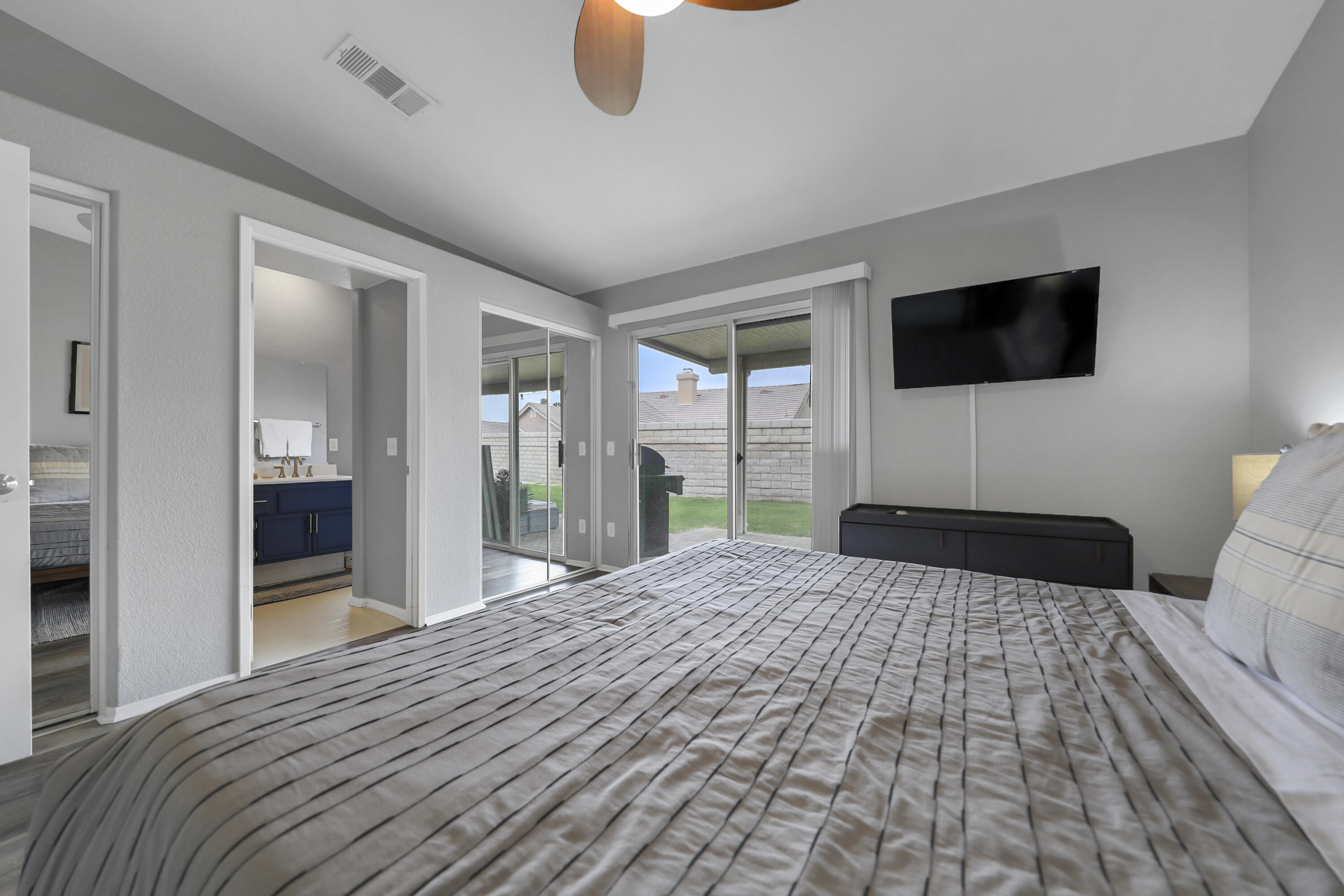 80490 Paseo Tesoro Indio, CA 92201 - Photo 12 of 28 a bedroom with a bed and a flat screen tv