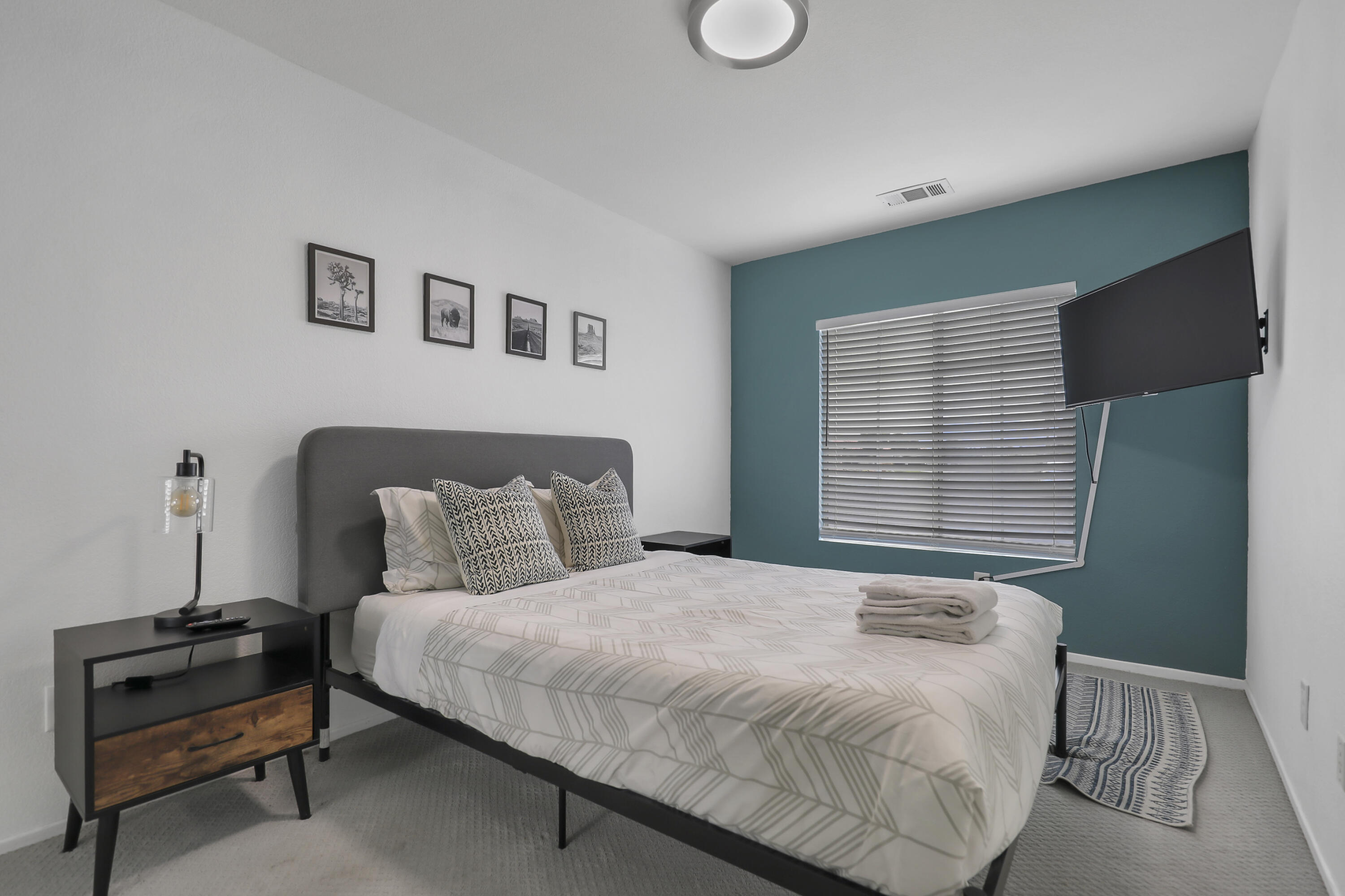 80490 Paseo Tesoro Indio, CA 92201 - Photo 17 of 28 a bedroom with a bed and a window