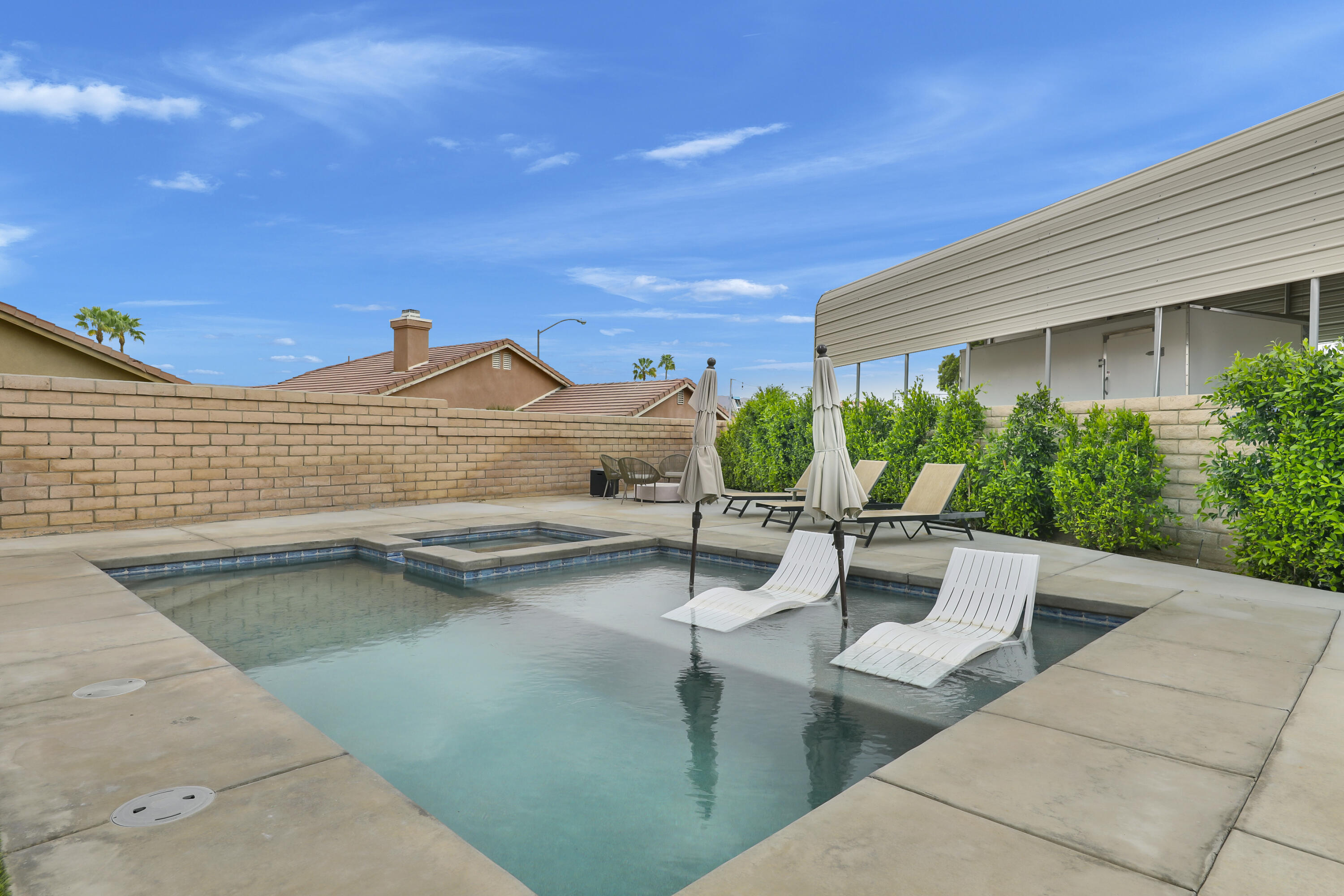 80490 Paseo Tesoro Indio, CA 92201 - Photo 21 of 28 a view of swimming pool with outdoor seating
