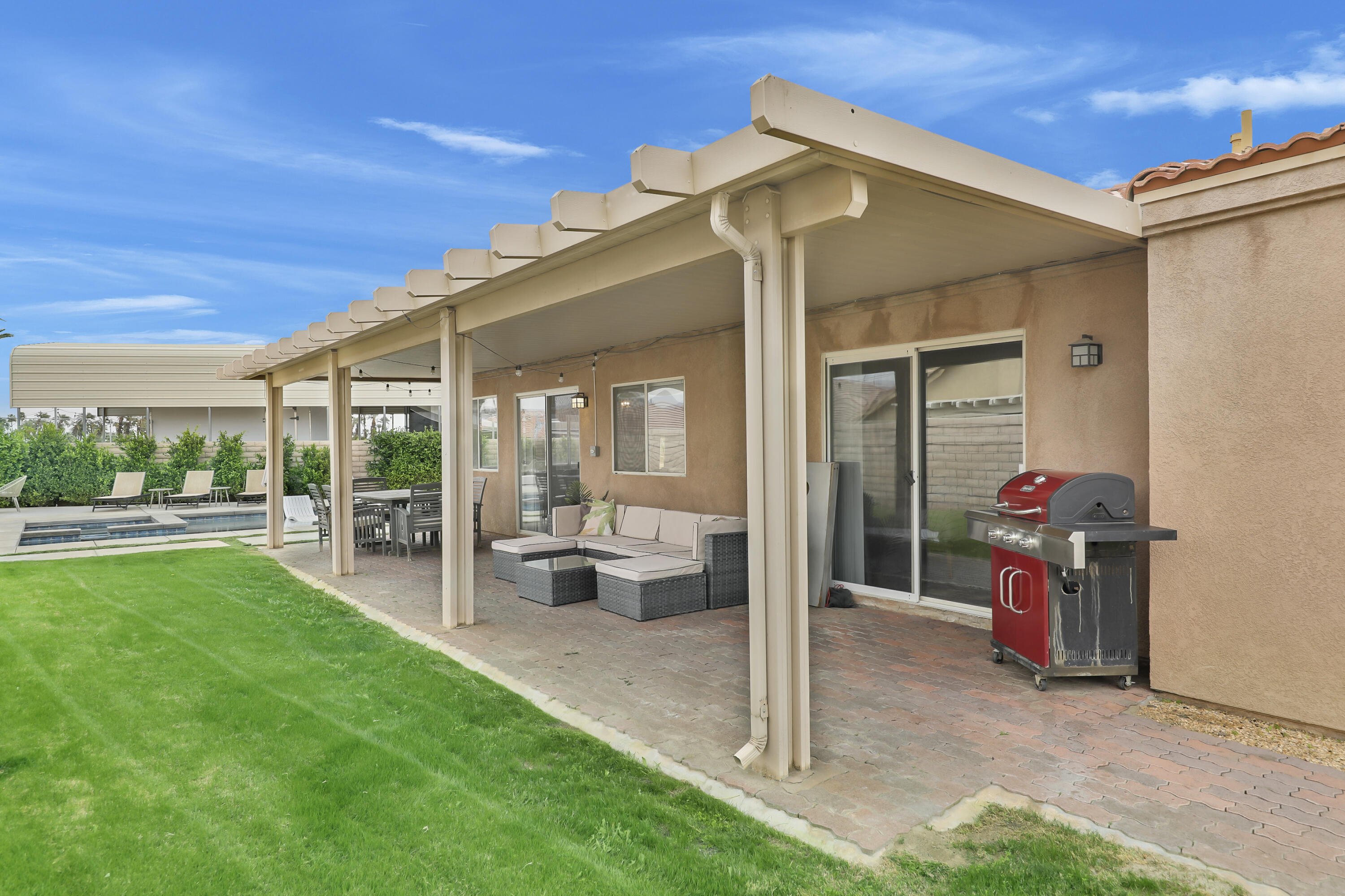 80490 Paseo Tesoro Indio, CA 92201 - Photo 23 of 28 a view of a house with backyard porch and sitting area