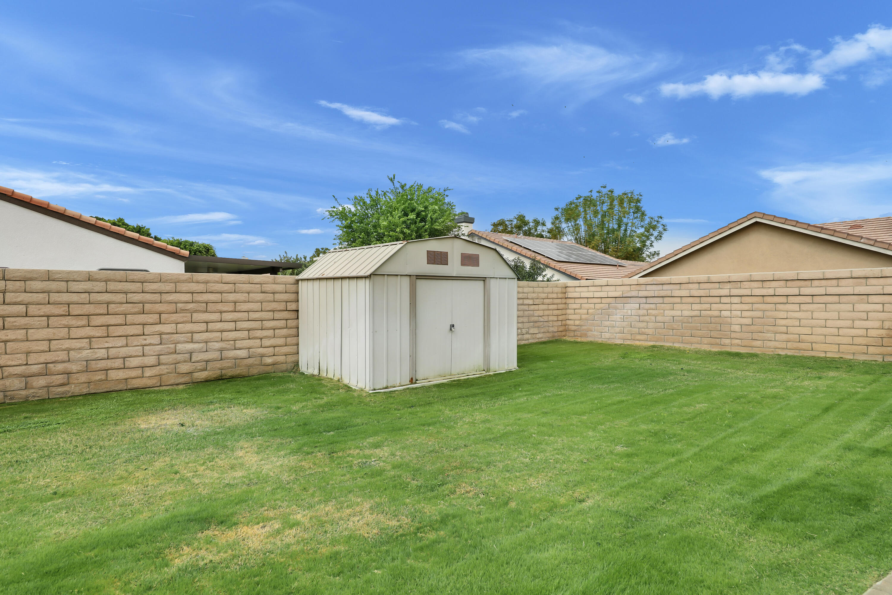80490 Paseo Tesoro Indio, CA 92201 - Photo 24 of 28 a view of a backyard with a garden
