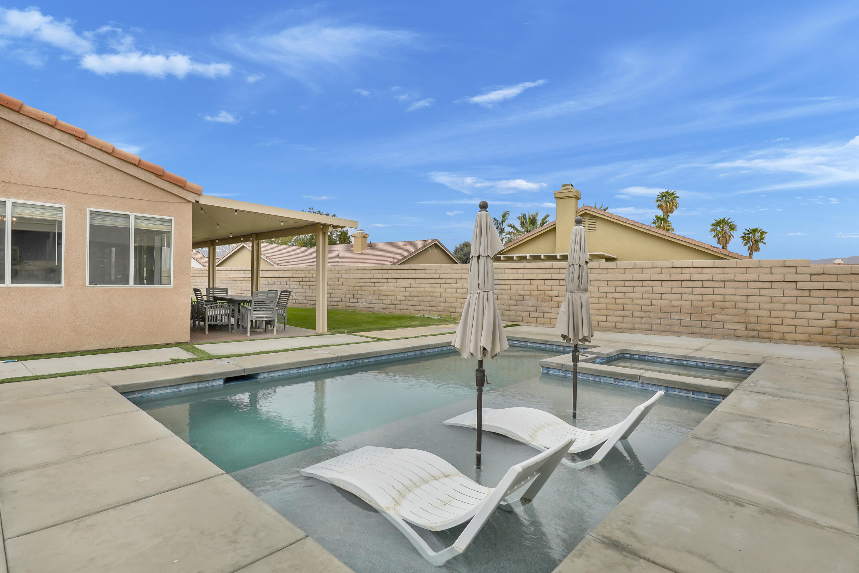 80490 Paseo Tesoro Indio, CA 92201 - Photo 3 of 28 a view of a patio with a table and chairs