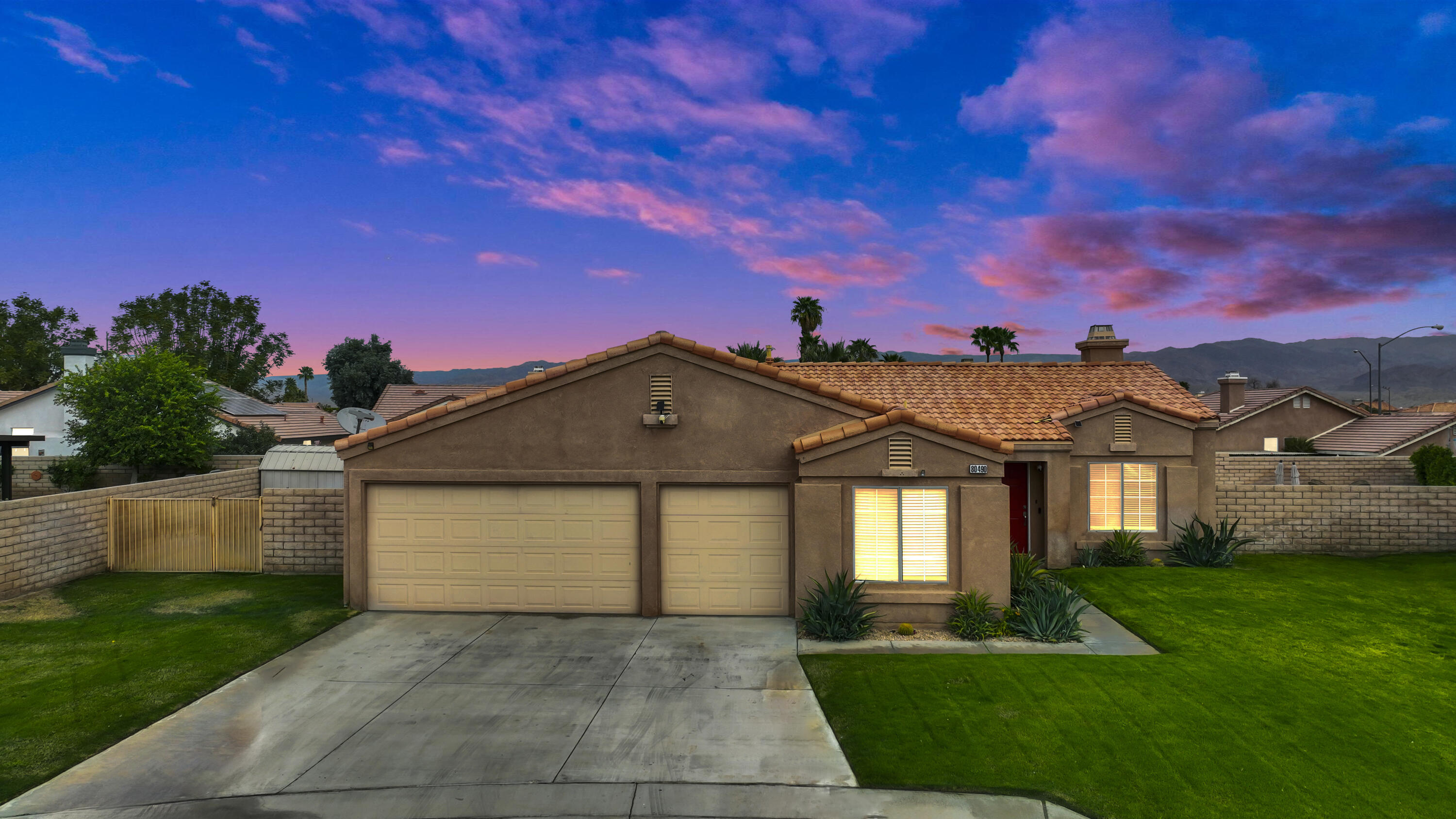 80490 Paseo Tesoro Indio, CA 92201 - Photo 4 of 28 a front view of a house with a yard