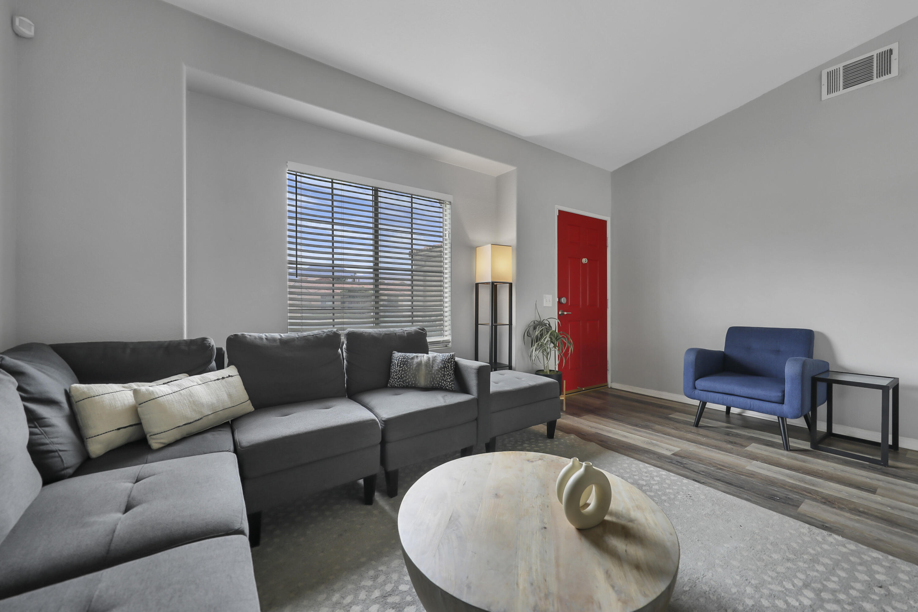 80490 Paseo Tesoro Indio, CA 92201 - Photo 5 of 28 a living room with furniture a air conditioner vent and a window