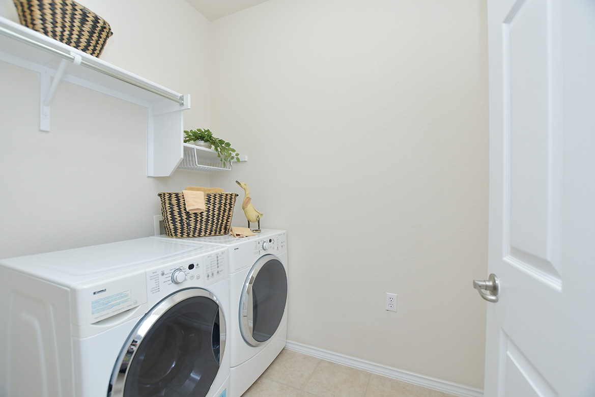 203 Winter Drive Georgetown, TX 78633 - Photo 24 of 29 A laundry room is found in the center of the home. Washer/dryer may convey.