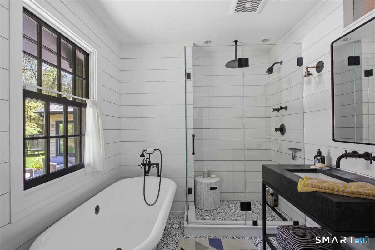 246 North Street Roxbury, CT 06783 - Photo 13 of 22 a bathroom with a granite countertop sink a toilet and shower