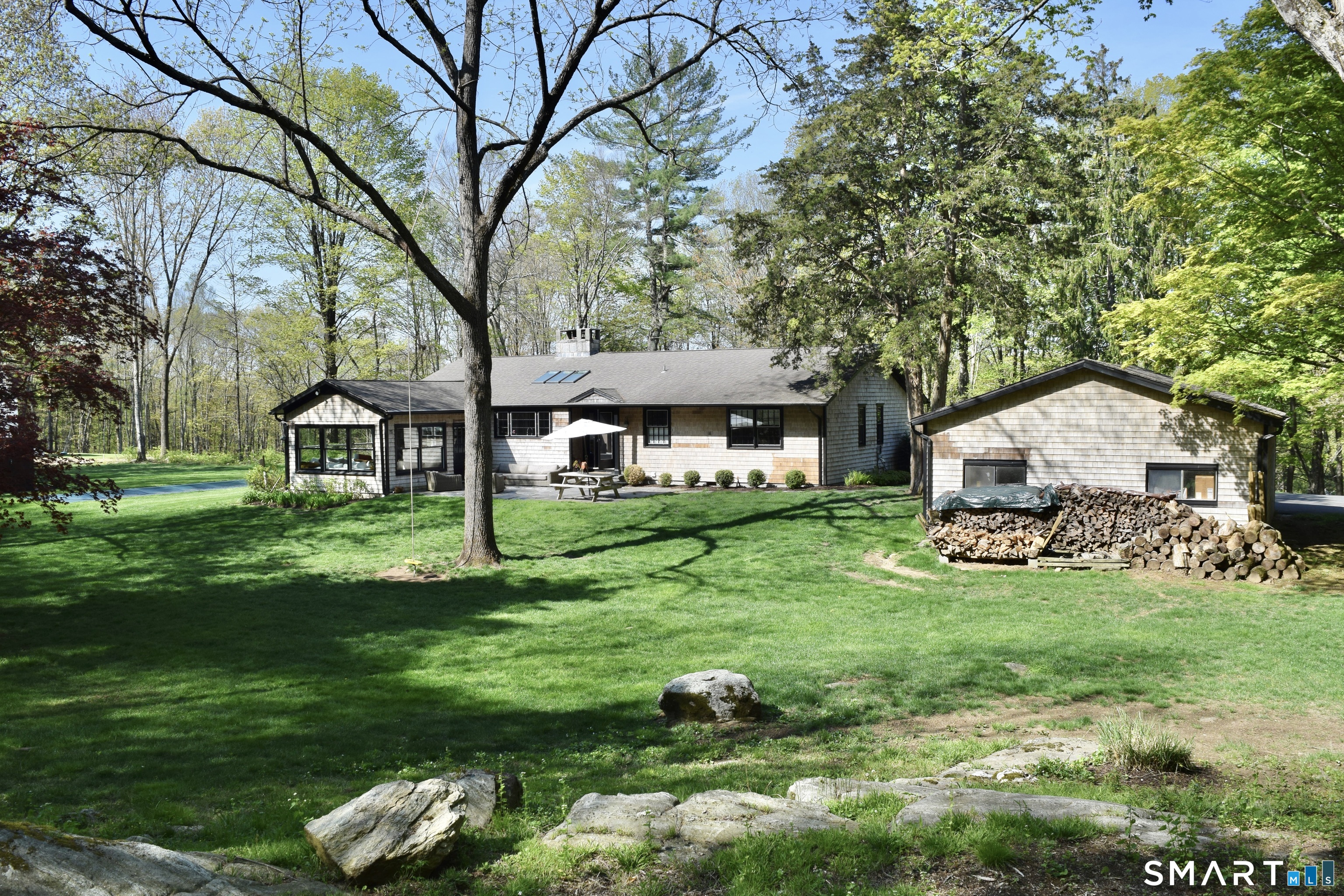 246 North Street Roxbury, CT 06783 - Photo 18 of 22 a front view of a house with garden