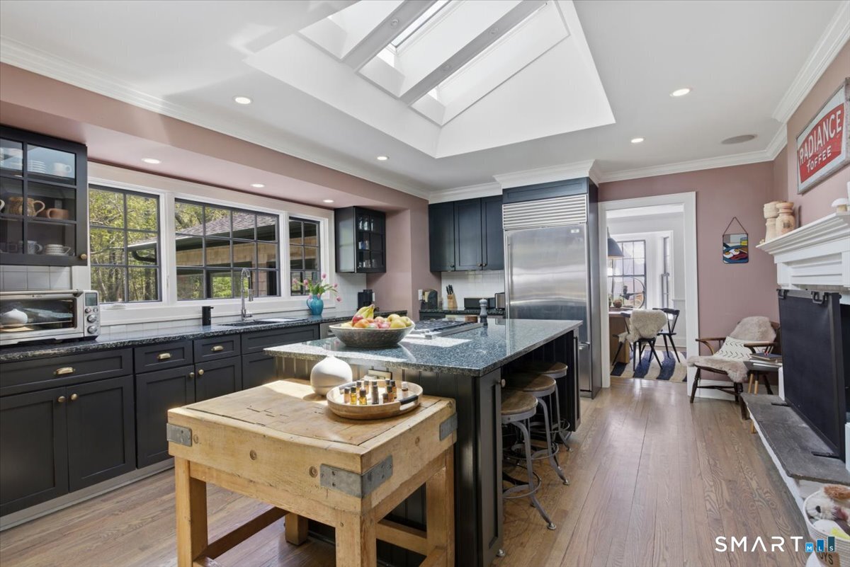 246 North Street Roxbury, CT 06783 - Photo 9 of 22 a kitchen with a table and chairs in it
