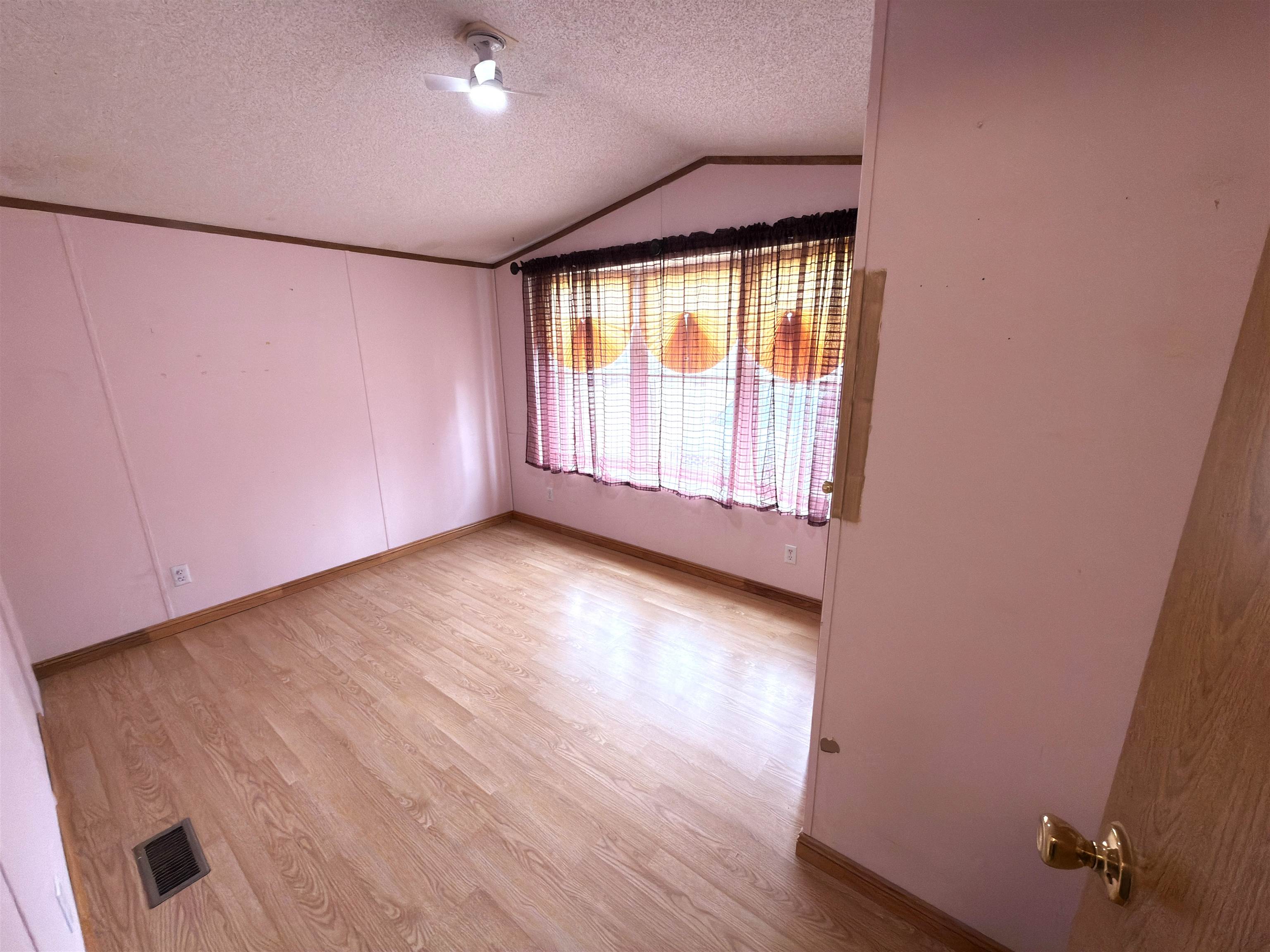 1206 Spring Circle Belvidere, IL 61008 - Photo 12 of 16 an empty room with wooden floor and windows