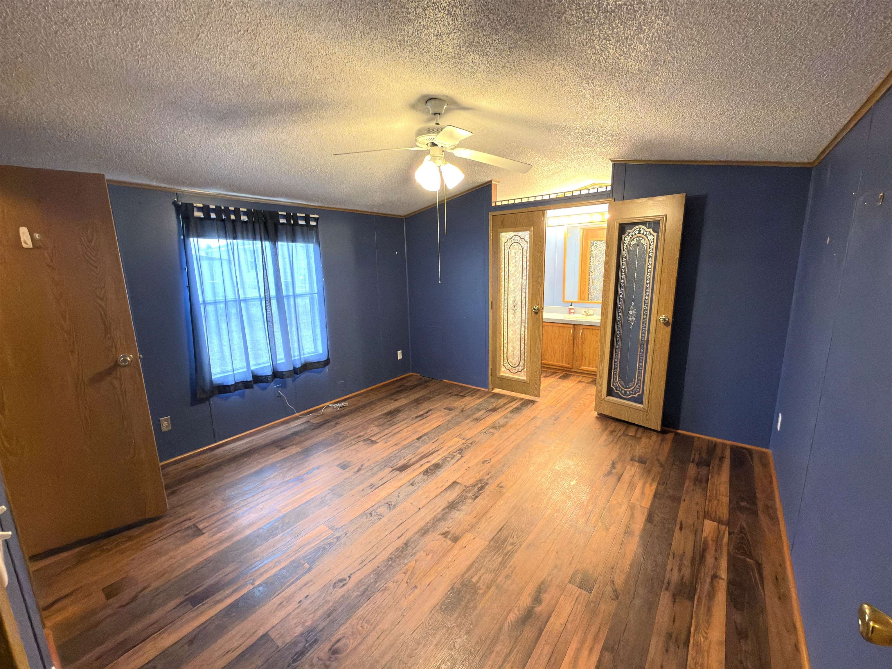 1206 Spring Circle Belvidere, IL 61008 - Photo 5 of 16 wooden floor in an empty room with a window