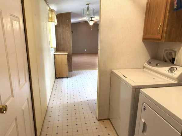 a bathroom with a sink a toilet a shower and a mirror