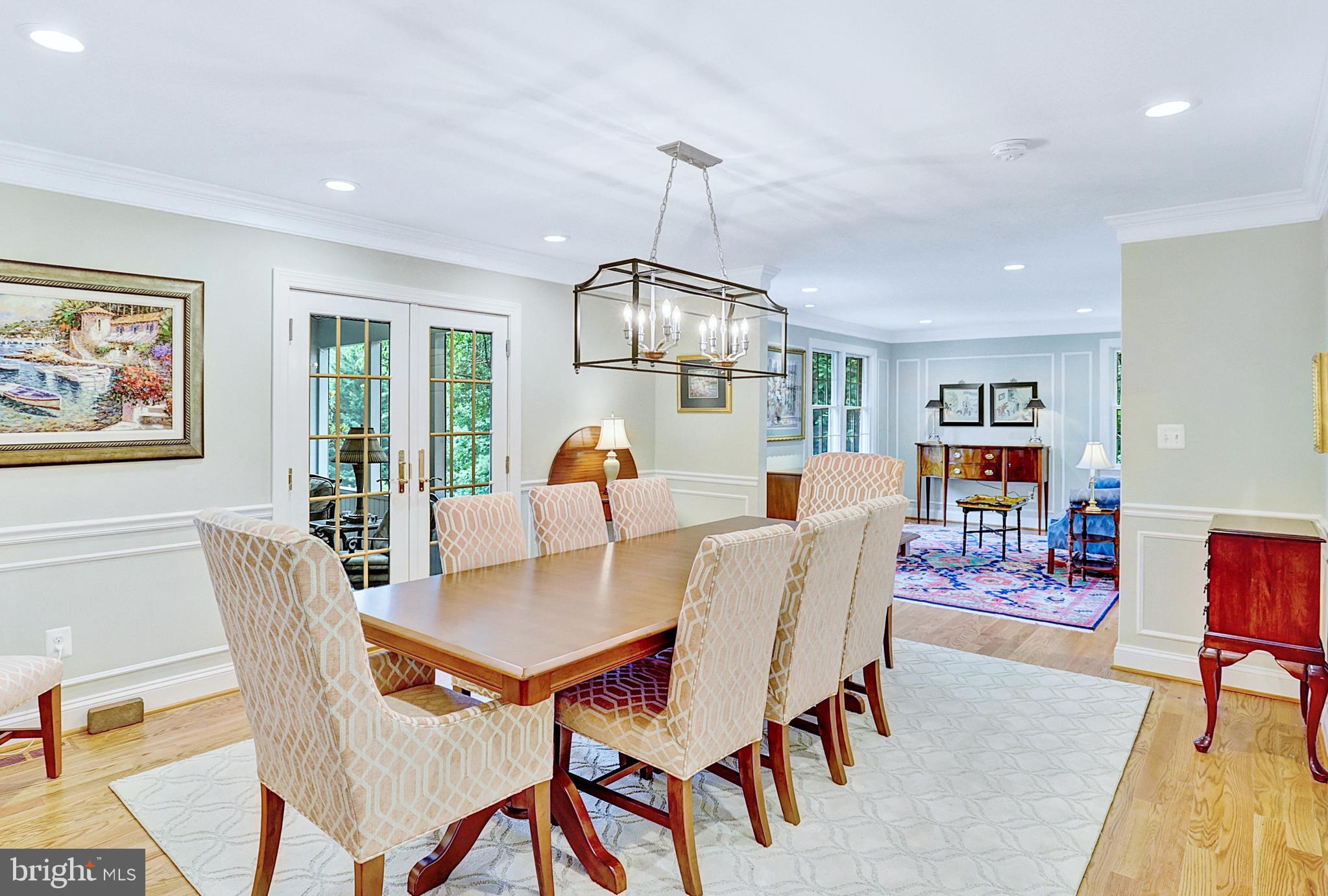 13713 Harcum Road Phoenix, MD 21131 - Photo 16 of 101 a dining room with furniture a rug and a chandelier