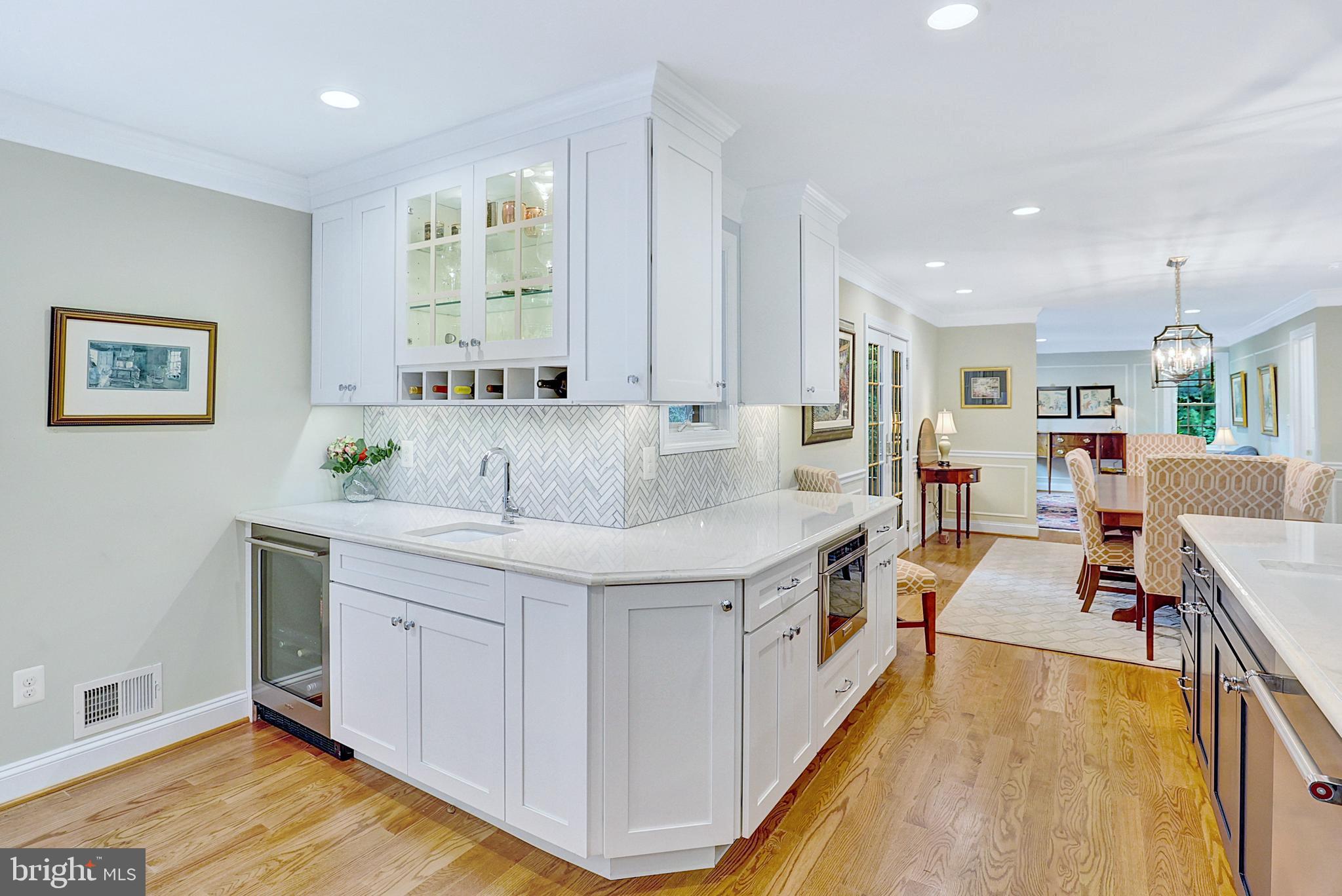13713 Harcum Road Phoenix, MD 21131 - Photo 25 of 101 a spacious kitchen with stainless steel appliances granite countertop a lot of counter space and wooden floor