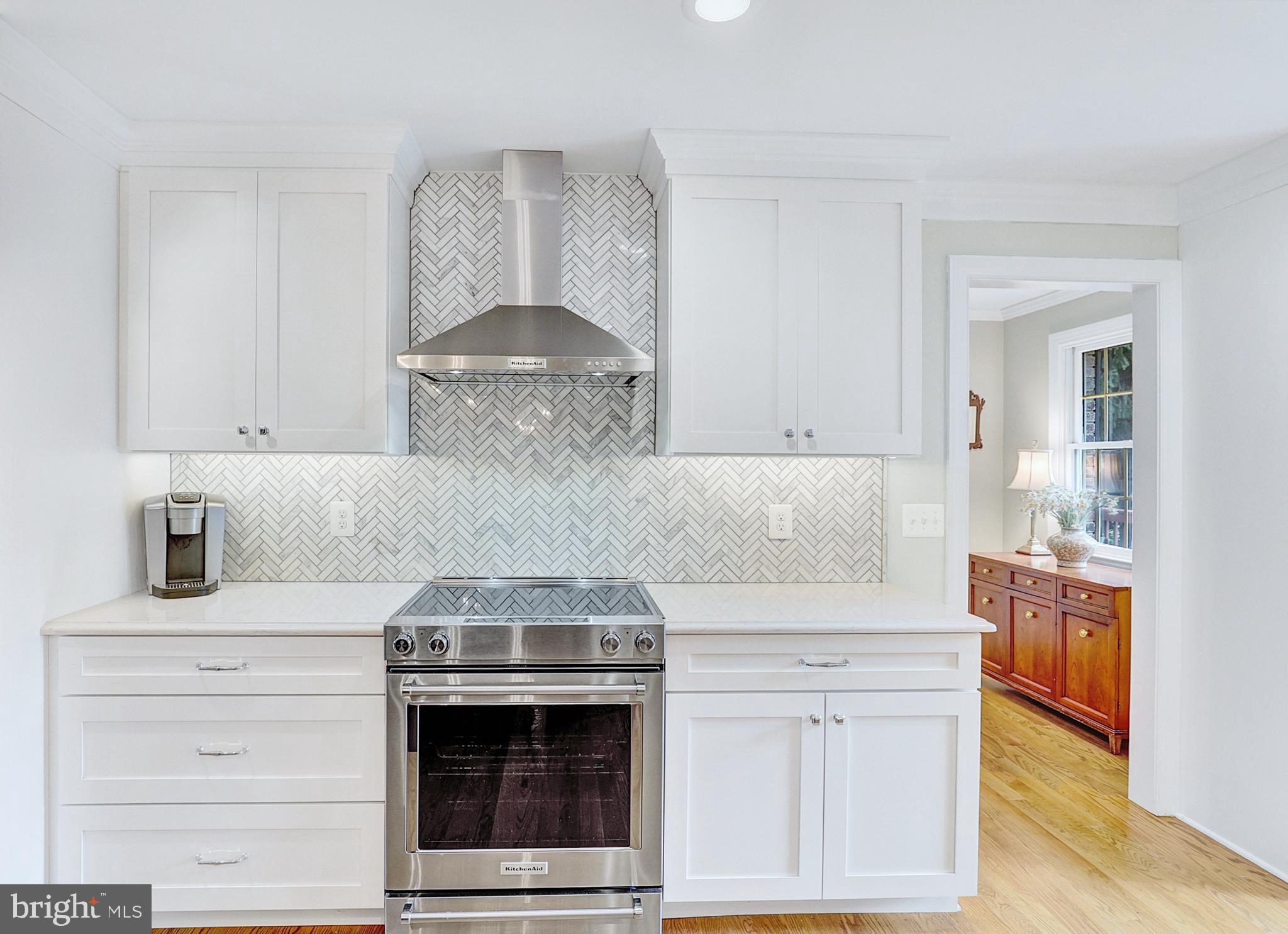 13713 Harcum Road Phoenix, MD 21131 - Photo 27 of 101 a kitchen with stainless steel appliances granite countertop a stove and a white cabinets