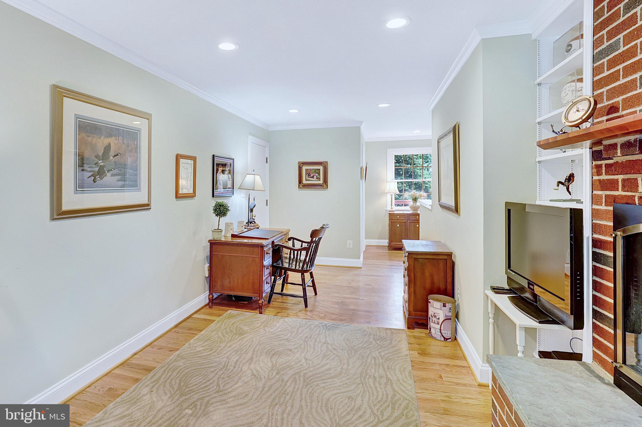 13713 Harcum Road Phoenix, MD 21131 - Photo 32 of 101 a living room with furniture a flat screen tv and kitchen view